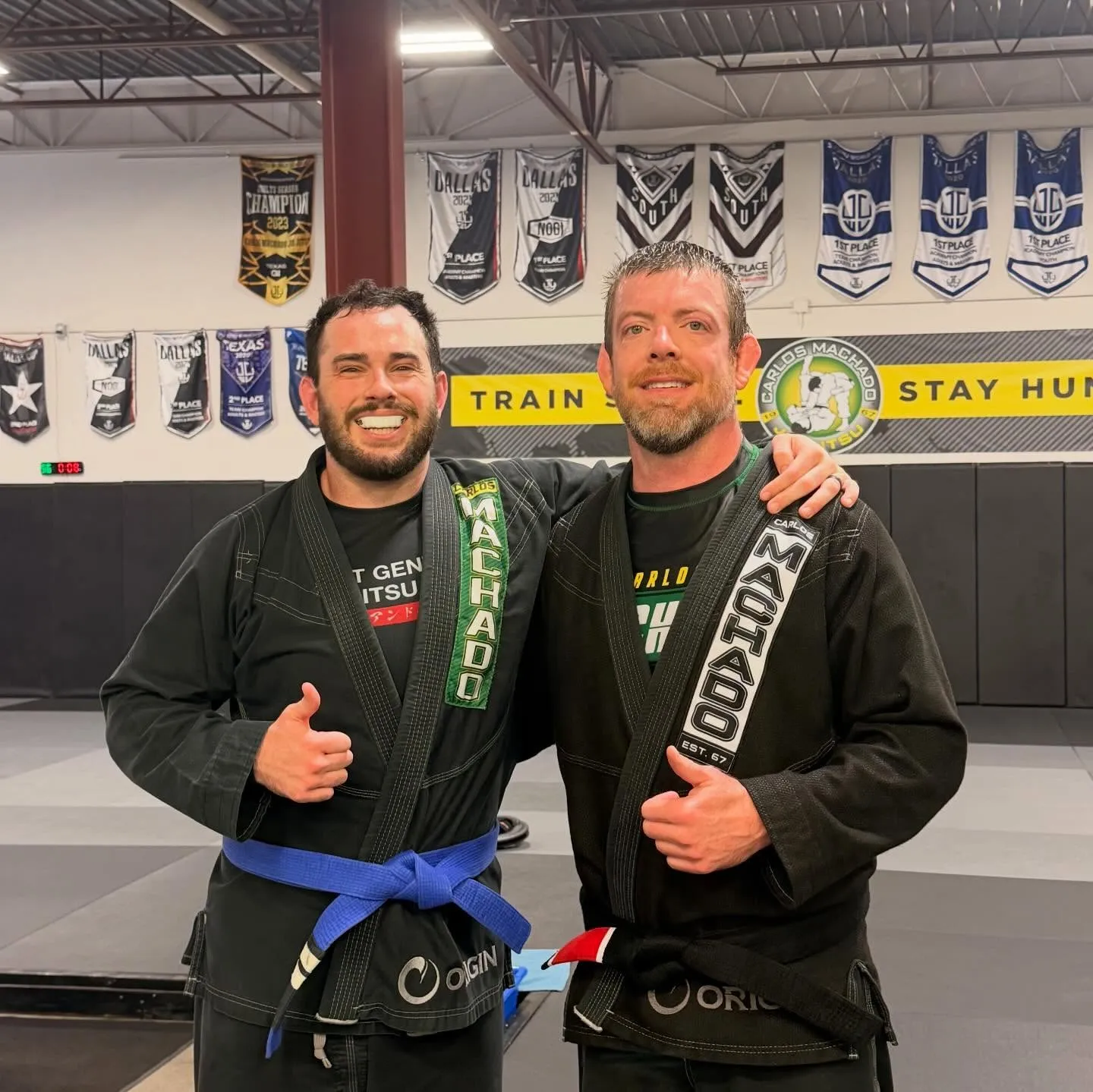 Machado Method students rolling during an adult Brazilian Jiu-Jitsu class in Carrollton, TX