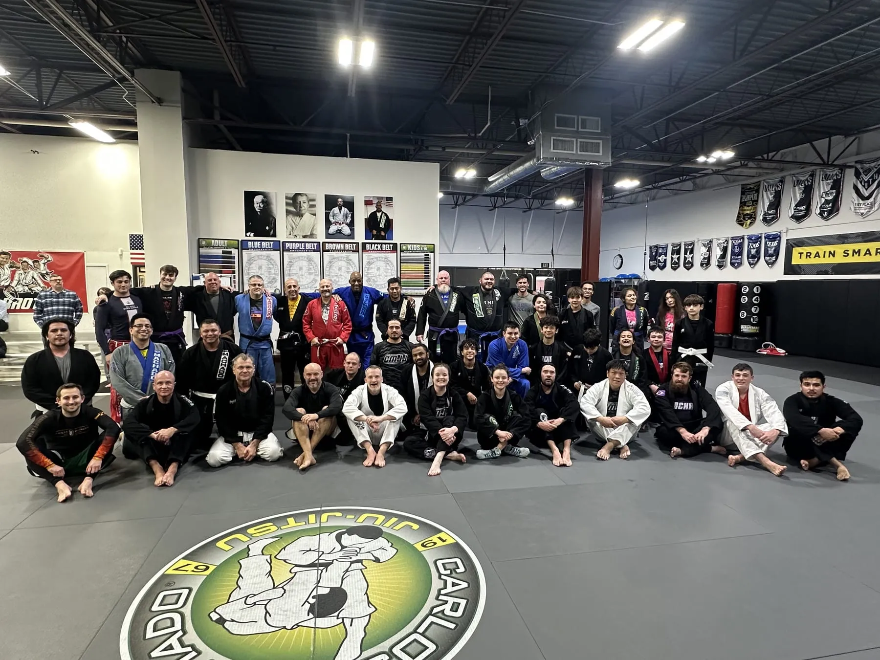 A group of adult Machado Method students together after a Brazilian Jiu-Jitsu class in Carrollton, TX