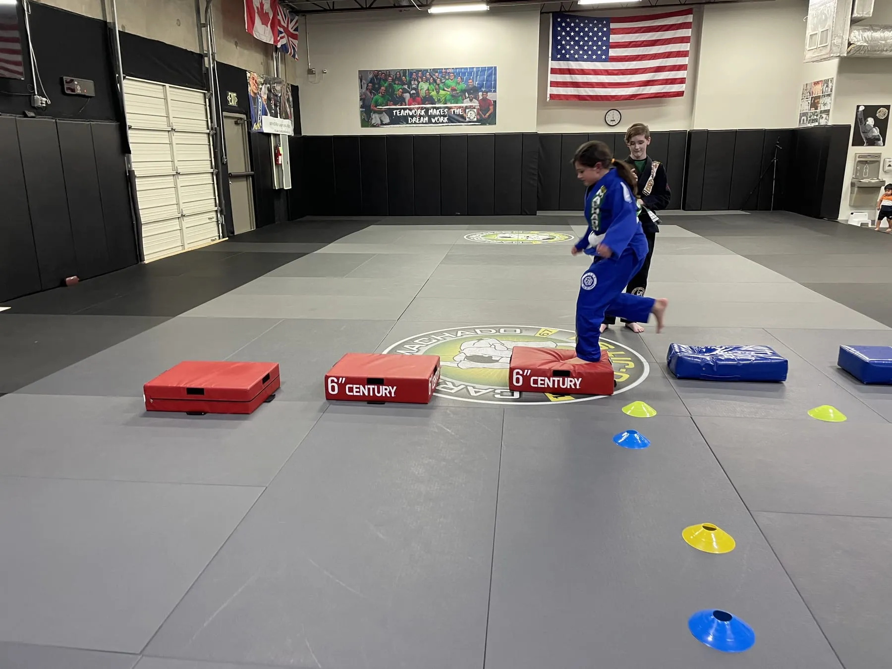 A young Machado Method student in his gi during a kids Brazilian Jiu-Jitsu class in Carrollton, TX