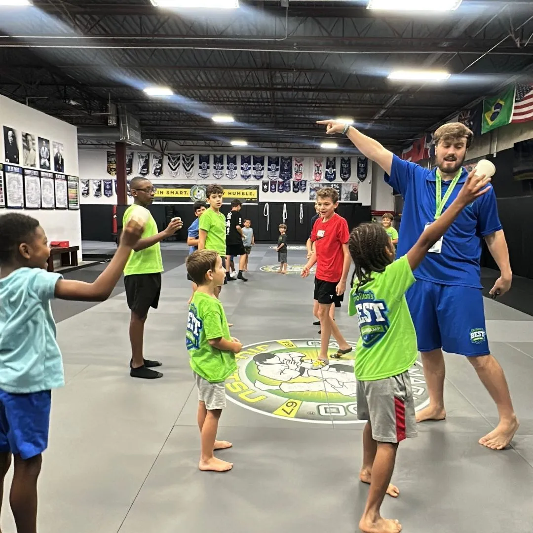 Carrollton's Best summer campers and their coaches together on the mat in Carrollton, TX