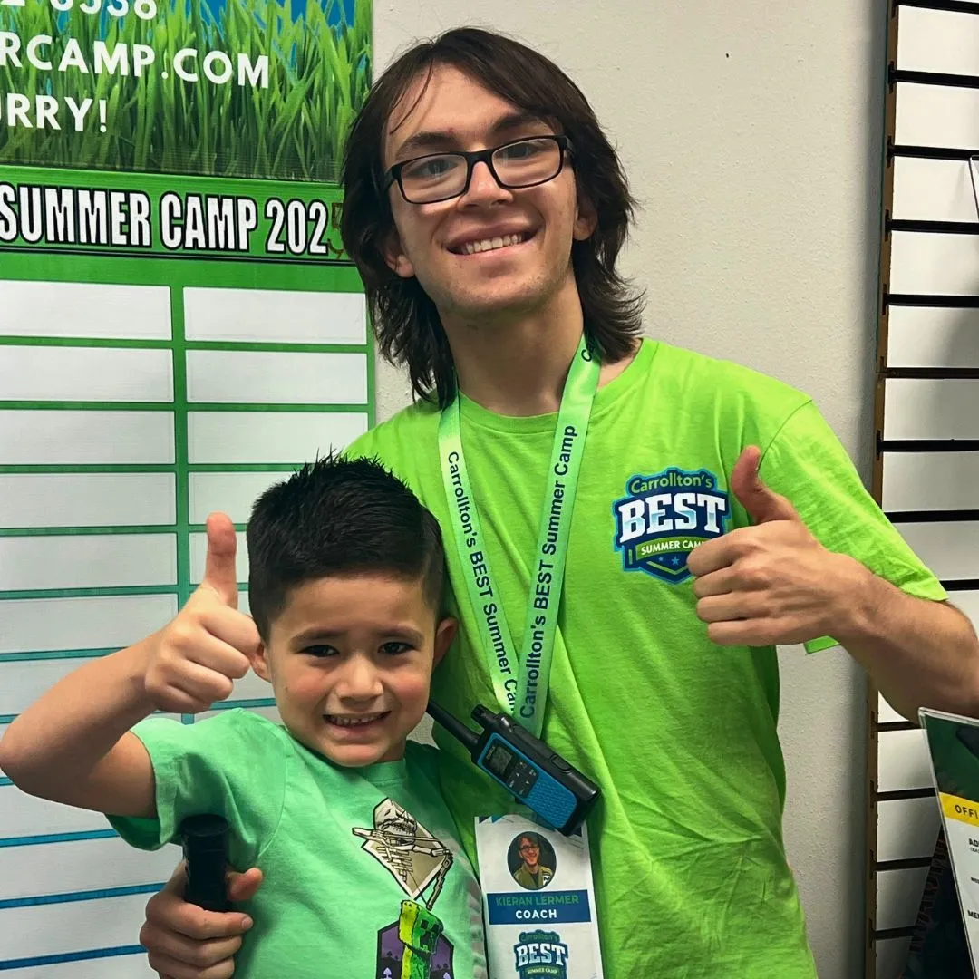 A Machado Method summer camp coach and a young camper giving a thumbs up in Carrollton, TX